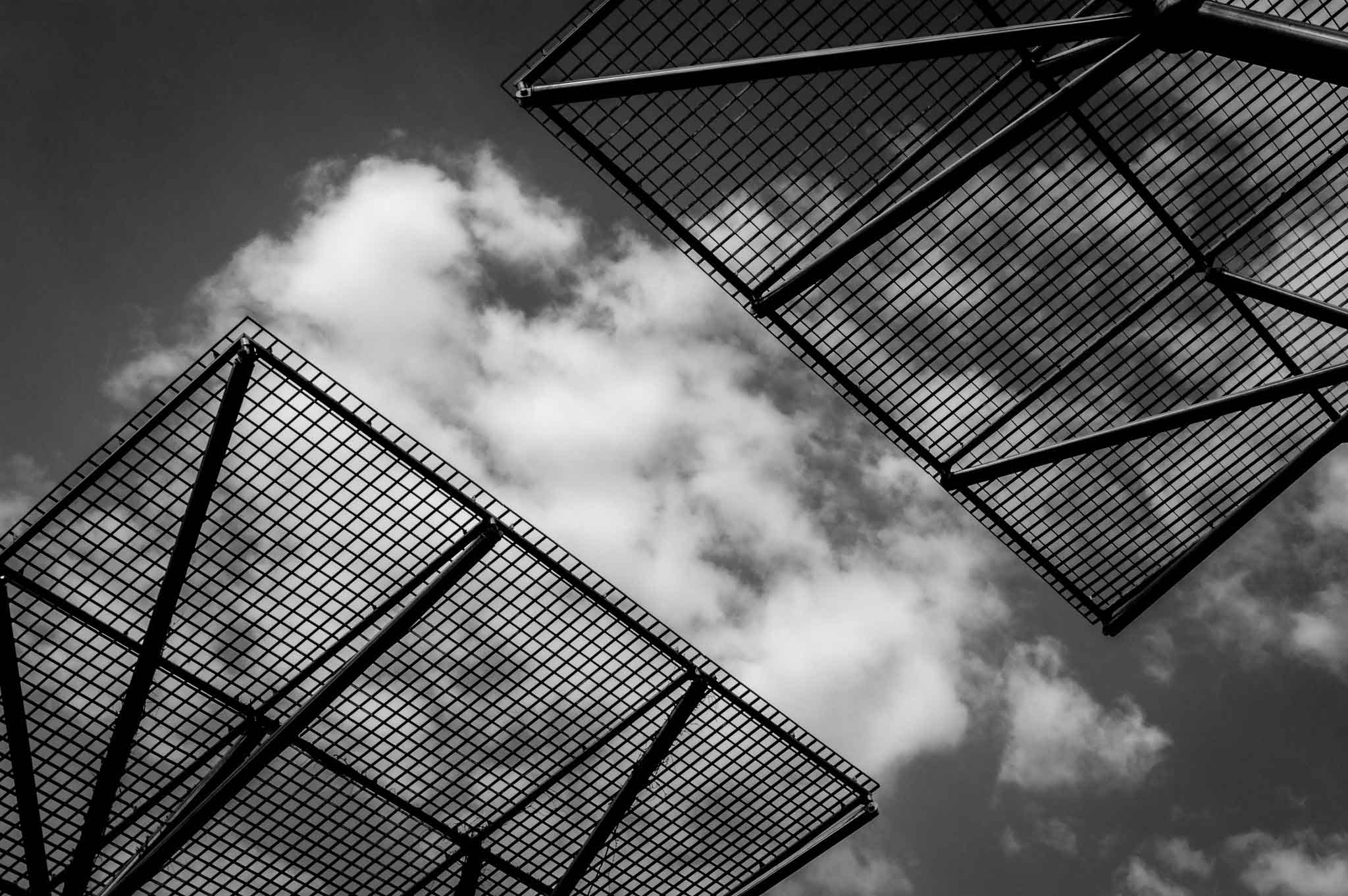 Stark silhouette of gates closing